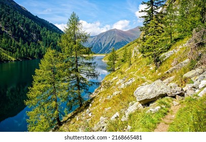 On The Mountainside Of The Lake. Lake In Mountains. Mountain Trail By Mountain Lake