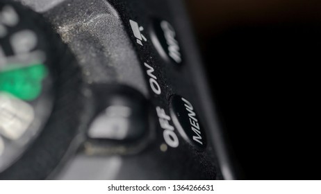 The On and Off buttons of the camera on a macro shot with the other buttons on the side