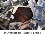 on an old wooden table there are old photographs of 1950-1960, , concept of family tree, genealogy, childhood memories, connection with ancestors