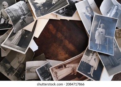 on an old wooden table there are old photographs of 1950-1960, , concept of family tree, genealogy, childhood memories, connection with ancestors - Shutterstock ID 2084717866