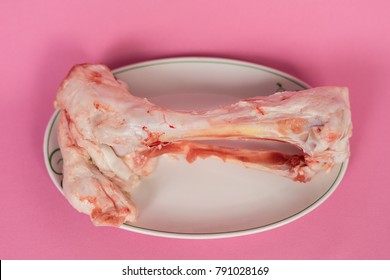 on a pink background is a plate in which the bone - Shutterstock ID 791028169