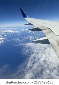 on the plane over clouds