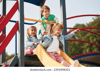 On the playground. Kids are having fun together. - Powered by Shutterstock