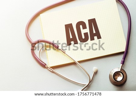 On a purple background a stethoscope with yellow list with text ACA Stock photo © 