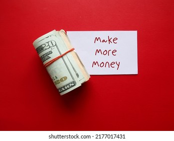 On red background, cash dollars money in rubber band with note paper written MAKE MORE MONEY, concept of make more income from side gig or second job to earn extra cash - Shutterstock ID 2177017431