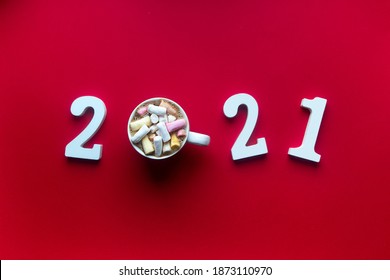On A Red Background With Wooden White Numbers It Is Written 2021 Instead Of 0 A Mug With Coffee With Marshmellow