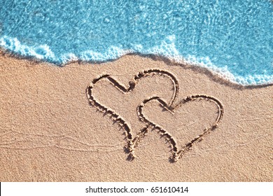 On the sand painted two hearts