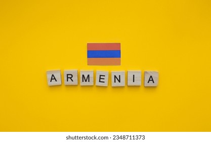 On September 21, Armenia Independence Day, the flag of Armenia, a minimalistic banner with an inscription in wooden letters - Powered by Shutterstock