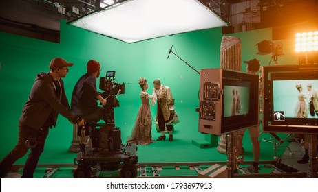 On Set: Famous Female Director Controls Cameraman Shooting Green Screen Scene with Two Actors Talented Wearing Renaissance Clothes Talking. Crew Shooting Period Costume Drama Movie. - Shutterstock ID 1793697913