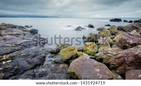 On Skernaghan Point’s rocky shoreline, Browns Bay, Islandmagee, County Antrim, Northern Ireland.