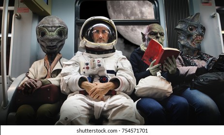 On A Spaceship, An Astronaut, Sitting Alongside Extraterrestrial Monsters, Travel In Total Relaxation Reading A Book. Concept Of Space Transport, Surrealism, Future, New Worlds.