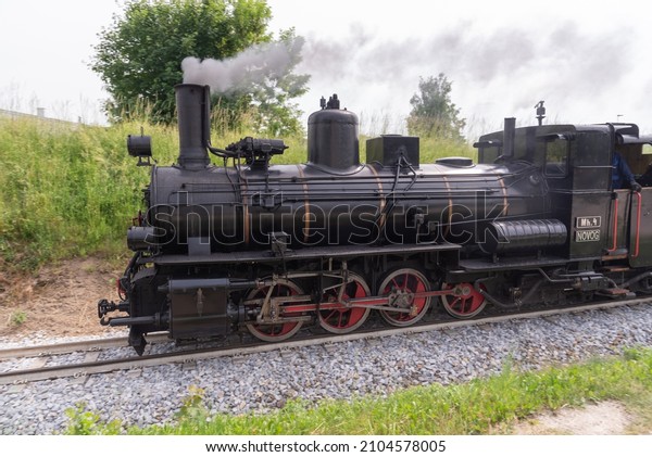 On a summer day a steam engine in Lower\
Austria steams to its destination.\
