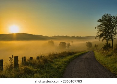 On Sunday morning I experienced one of the most beautiful sunrises here at home. The color of the suns with the fog and the light were unique. - Shutterstock ID 2360107783
