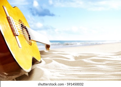 
On A Sunny Beach Guitar And Suitcase