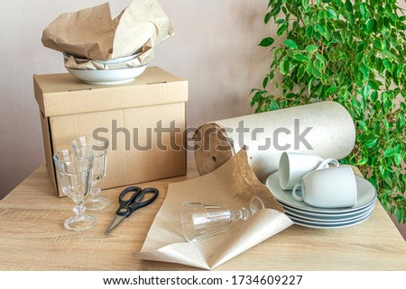 Similar – Image, Stock Photo Woman carefully cutting paper design in studio