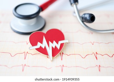 On Table Lies Stethoscope Cardiogram And Heart Sign. Heart And Vascular Disease Concept