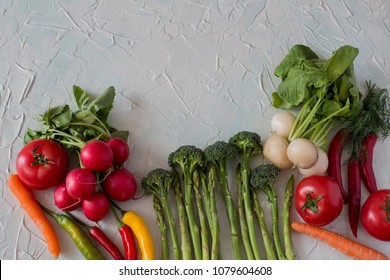 on the table vegetables: broccoli, pepper, tomato, carrot, radish