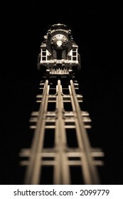 On Track (Old worn model train engine with nicks and scratches, focus on model train)