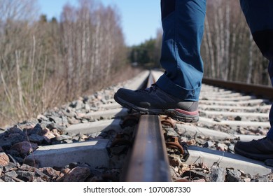 On the train tracks.