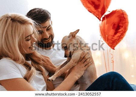 Similar – Image, Stock Photo Affectionate couple sharing a cozy moment on a sofa