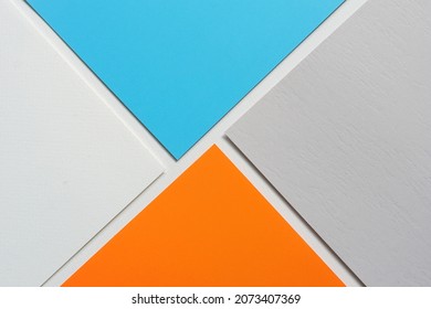 On a white background, an abstract background notion of blue and gray and orange blank paper alignment - Shutterstock ID 2073407369