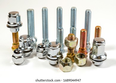 on white background closeup new shiny car nuts   bolts