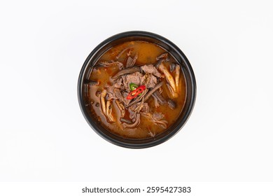On a white background, inside an earthen pot, Spicy Korean Beef Soup
