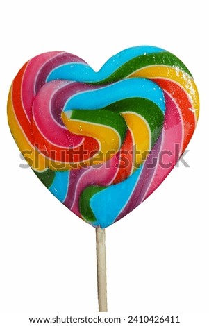 On a white background, a large multi-colored heart-shaped lollipop . sweets. a lot of calories