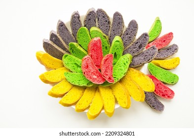 On a white background is a large white plate with colored sliced ​​bread.  Adding colors makes the bread more stylish, beautiful, amazing.  Banner, copy space for text. - Shutterstock ID 2209324801