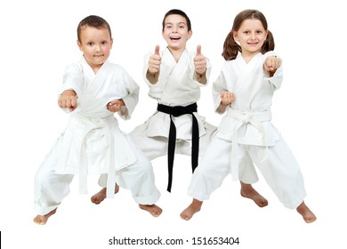 On a white background little children express the delight of karate lessons