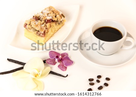on a white background stands a cup of coffee and a plate with cake and orchids as decoration Stock foto © 