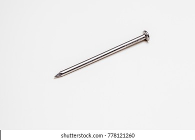 On A White Background There Is An Iron Nail