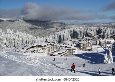 On The White Slopes Of Pamporovo, A Ski Resort In Bulgaria, Skiing People.