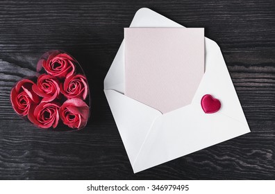 On A White Wooden Table Composition For Valentine's Day, Heart Tissue In An Envelope, A Letter, A Pen, There Is A Blank Space For Text Greetings