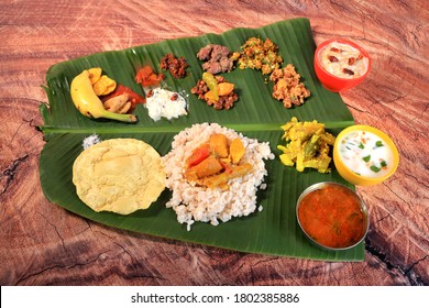 Onam banquet or onam sadhya ,Vishu sadhya- traditional Kerala food in wood background