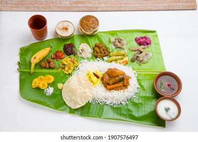 Onam sadhya served in banana leaf, south indian vegeterian meal arranged in traditional way