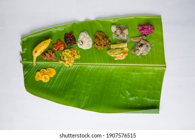 Onam sadhya served in banana leaf, south indian vegeterian meal arranged in traditional way