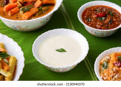 Onam sadhya , Vishu traditional South Indian vegetarian curry side dish of rice curd , Yogurt Moru curry sambar ginger pickle Kerala , India , Sri Lanka, coconut oil, Indian spices cooking Pongal