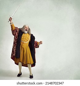 Once more into the breach. Studio shot of a richly garbed king brandishing a sword. - Shutterstock ID 2148702347