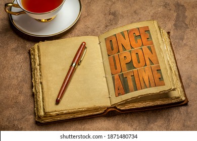 Once Upon A Time Opening Phrase - Storytelling Concept - Wood Type Word Abstract In A Retro Jornal With A Cup Of Tea