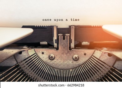 Once Upon A Time Typed Words On A Vintage Typewriter.  Selective Focus And Vintage Tone Color 