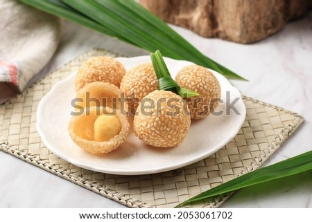Onde-onde Sesame Seed Ball, Served on White Plate Close Up. Popular Indonesian Snack with Chinese Influence