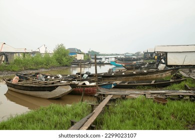 Ondo State, Nigeria - May 2nd, 2023 - Engine boats parked at the bank of Abereke River in a riverine community of Ilaje, Ondo State.