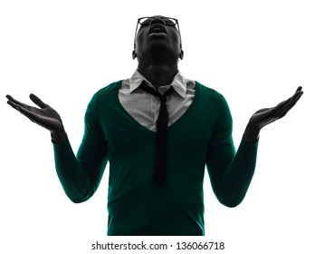 one african  black man looking up complaining  in silhouette studio on white background