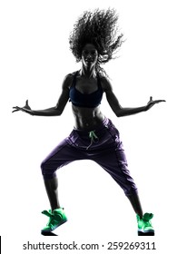 one african woman woman zumba dancer dancing exercises  in studio silhouette isolated on white background