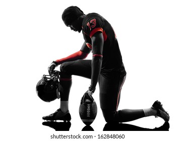 one  american football player kneeling  in silhouette shadow on white background - Powered by Shutterstock