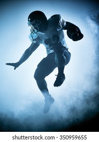 One American Football Player Portrait In Silhouette Shadow On White Background