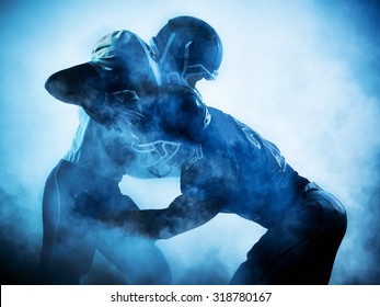 one american football players portrait in silhouette shadow on white background
