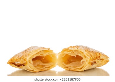 One aromatic puff pastry bun with apples cut in half, macro, isolated on white background. - Powered by Shutterstock