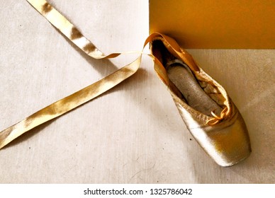 gold pointe shoes